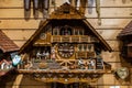 Vintage cuckoo clock on a wooden wall in Triberg im Schwarzwald, Germany.