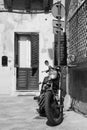 Vintage custom motorcycle standing in the street  of old italian town. Lecce, Apulia, Italy Royalty Free Stock Photo