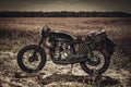 Vintage custom motorcycles in field Royalty Free Stock Photo