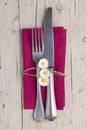 Vintage cutlery - fork and knife on purple napkin Royalty Free Stock Photo