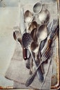 Vintage cutlery on rustic background, old kitchen tools from above Royalty Free Stock Photo