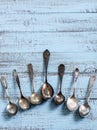 Vintage cutlery - spoons, forks and knives on an old wooden background