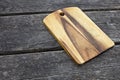 Vintage cutting board on old wooden background