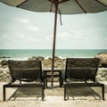 Vintage daybed and umbrella on the beach