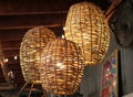 Vintage decorating at an Antiques store with three woven wicker basket round light fixtures