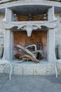 Vintage decorative interior design of stone fireplace with wood and a pot Royalty Free Stock Photo