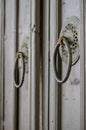 Vintage designed hotel entrance. Old wooden gate door handle Royalty Free Stock Photo