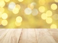 empty rustic wooden counter top with blurred yellow gold and white christmas lights bokeh background Royalty Free Stock Photo