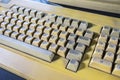 Vintage desktop keyboard under bright light