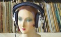 Vintage display dummy, mannequin with headphone and vinyl records, HIFI and analog music concept
