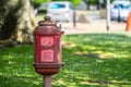 Vintage dog waste bin in the park for responsible owners to dispose of their dog`s toilet