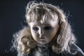 Vintage doll face on dark background Royalty Free Stock Photo