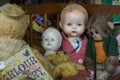 Vintage dolls, teddies and monkey at flea market