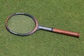 Vintage Donnay Borg Pro tennis racket on the grass tennis court.