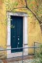 Vintage door in front of a yellow wall, Rome, Italy Royalty Free Stock Photo