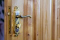 Vintage door handle on wooden doors close-up Royalty Free Stock Photo