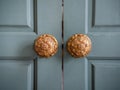 Vintage door knobs on wooden door Royalty Free Stock Photo