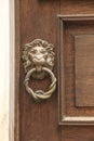 Vintage door knocker on wooden door Royalty Free Stock Photo