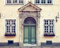 Vintage door on a medieval building facade in Riga, La