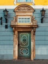 Vintage door on a old building facade with retro lamp Royalty Free Stock Photo