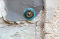 Vintage doorbell on the old wall of an ancient house