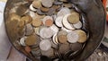 Heap of obsolete Greek coins drachma inside old tin can Royalty Free Stock Photo