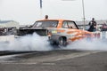 Vintage drag car in action at the starting line Royalty Free Stock Photo