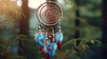 Vintage Dream Catcher Blue Coral on a background of nature. ethnic amulet with a boho vibe