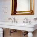 Vintage dubbel washbasin against tiled wall