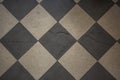 Vintage earthenware floor tiles from 20s in black and white, abstract backdrop