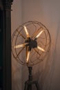 Vintage Edison lamp, floor long lamp in a black forged cage in the form of a fan Royalty Free Stock Photo