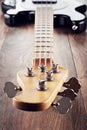 Vintage electric bass guitar on wooden table background Royalty Free Stock Photo