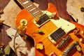 Vintage electric guitar, dried flowers and rare notes close up