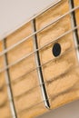 Vintage electric guitar fretboard with steel strings. Royalty Free Stock Photo