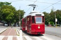 Vintage electric tram at stop station