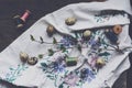 Vintage embroidery, wooden thread spools and quail eggs Royalty Free Stock Photo