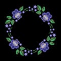 Vintage embroidery wreath with violet, forget me not. Vector fashion ornament on black background for textile, fabric traditional