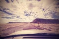 Vintage endless road, photo taken from front seat of a car, USA.