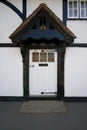 Vintage English white front door on Tudor style heritage building