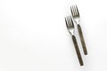 Vintage engraved silverware forks isolated on a white background