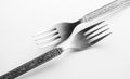 Vintage engraved silverware forks isolated on a white background