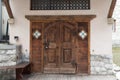 Vintage entrance door of european style building in Cortina d`Ampezzo, Italy