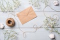 Vintage envelope with flowers on light blue wooden background. Banner mockup for womans or mother day, wedding invintation, easter