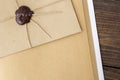 Vintage envelope with a wax seal on the table Royalty Free Stock Photo