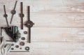 Locksmith vises, dies of different diameters and work gloves on a wooden background. Royalty Free Stock Photo