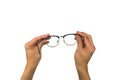 Vintage eye glasses hand holding isolated with clipping path Royalty Free Stock Photo