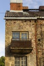 Vintage facade of old brick building in downtown, vertical Royalty Free Stock Photo