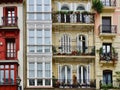 Vintage facades of colourful elegant buildings in Bilbao, Basque Country, Spain. Multicoloured houses, colourful street, flowers