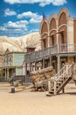 Vintage Far West town with saloon. Old wooden architecture in Wild West Royalty Free Stock Photo