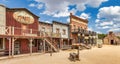 Vintage Far West town with saloon. Old wooden architecture in Wild West